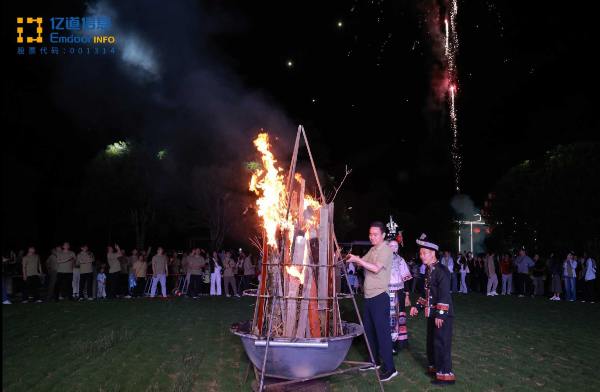 As Mr. Liu lit the flames, team members joined hands, dancing and singing under the stars